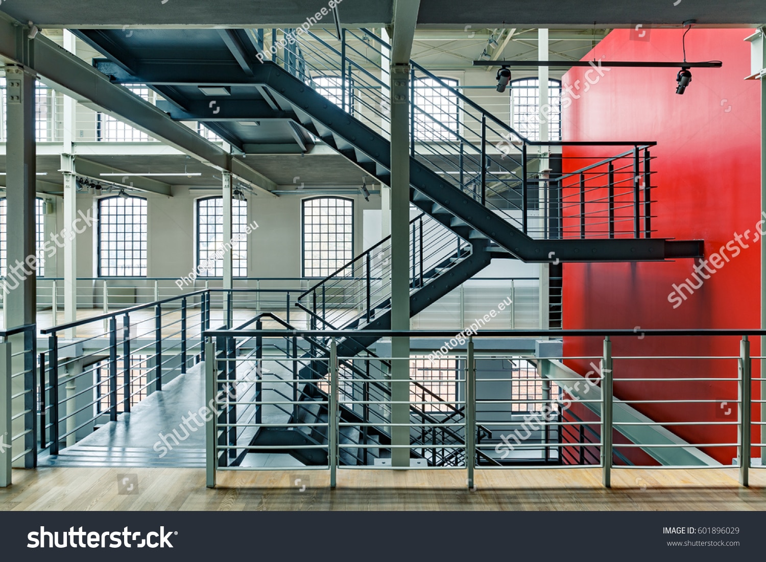 stockphotoindustrialbuildinginteriorwithredwallandblackmetal