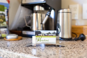 The Meadows Villa business card with coffee machine